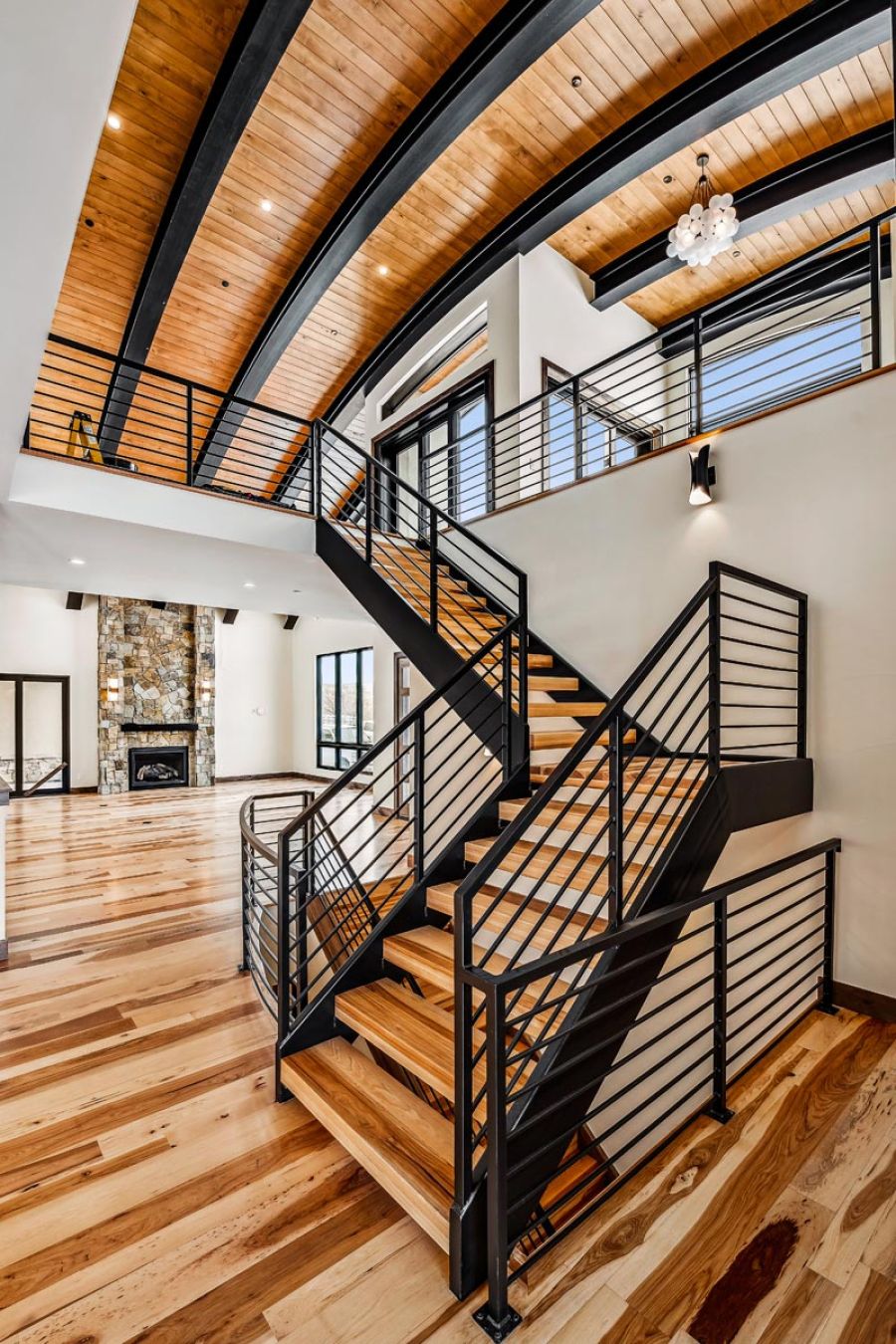 Dramatic curved ceiling and stairway