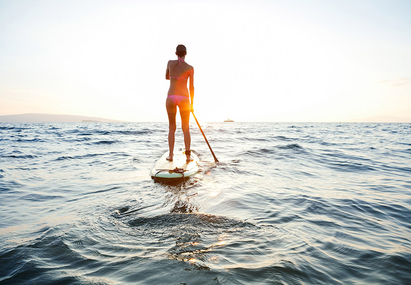 Woman paddle boarding